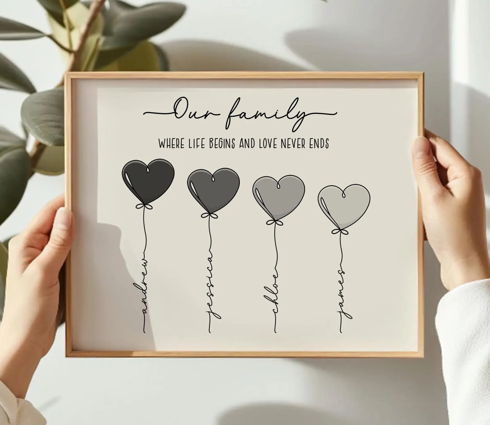 Personalized heart balloon family print with four custom names and quote in a wooden frame