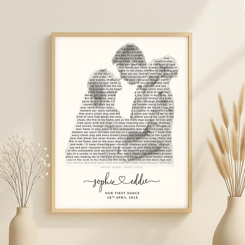 Personalized first dance lyrics print featuring a couple silhouette filled with song lyrics, names and wedding date in elegant typography