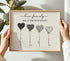 Personalized heart balloon family print with four custom names and quote in a wooden frame